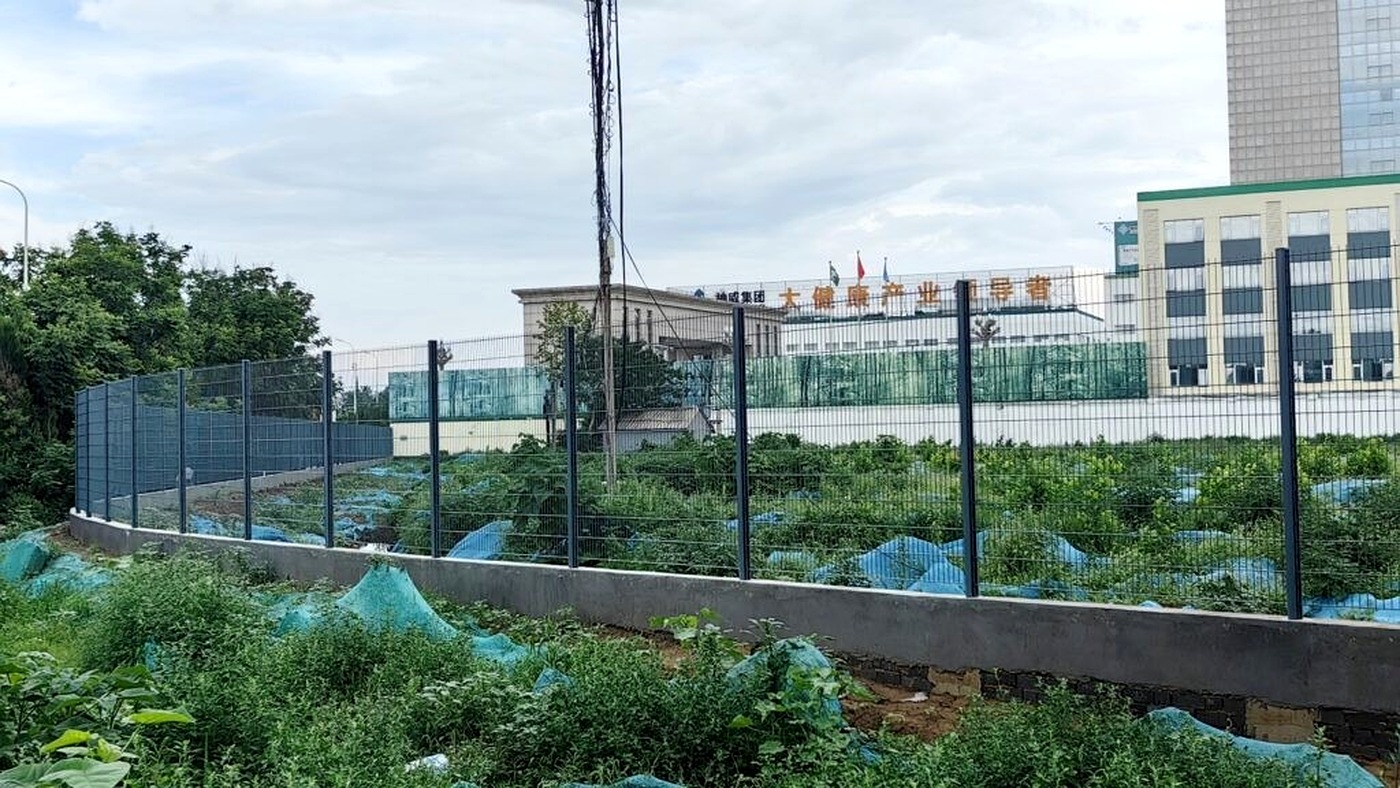 Open and screened perimeter fence sections adapted to the surrounding conditions