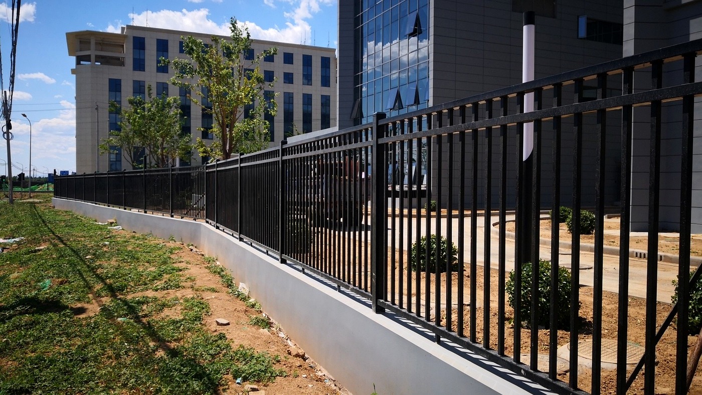 Square-tube steel fence coordinated with the pharmaceutical plant architecture