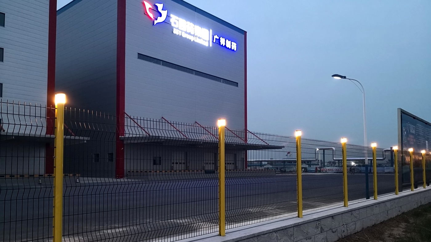 3D welded wire mesh fence with integrated LED post lighting at night