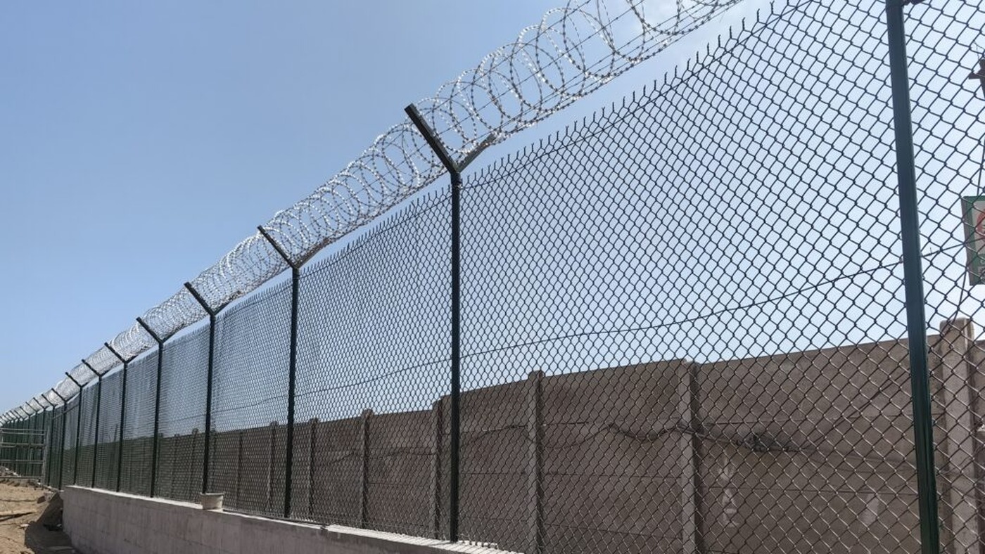 High security perimeter fence with top protection