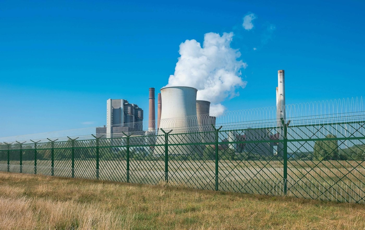 High-security metal perimeter fencing around nuclear and energy infrastructure