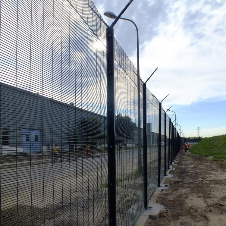 High-security perimeter fence installed around an industrial facility