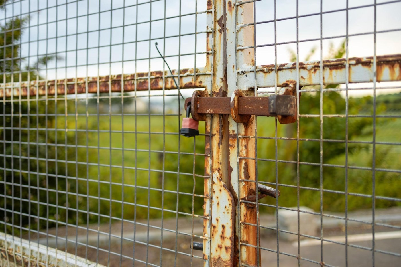 Corroded fence connection and aged coating detail