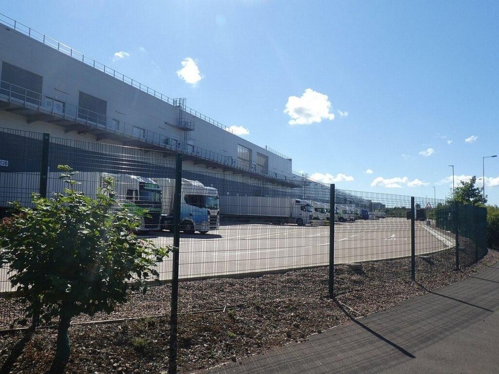 Perimeter fencing separating a large logistics park from vehicle operating areas