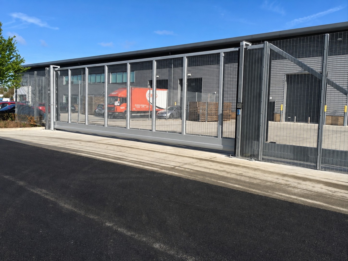 Large sliding vehicle gate at a logistics park access lane