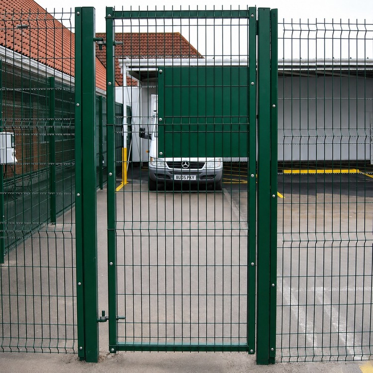 Pedestrian gate integrated with the main perimeter fence