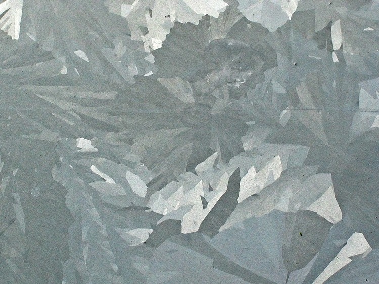 Close-up of the crystalline texture of a hot-dip galvanized surface