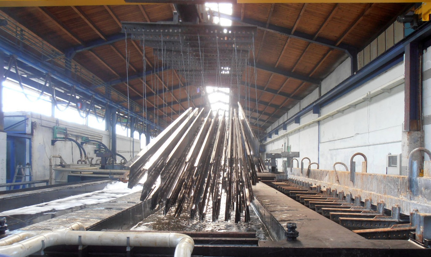 Steel components being lifted during hot-dip galvanizing
