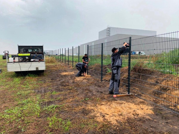 Welded mesh fence installation on a business campus