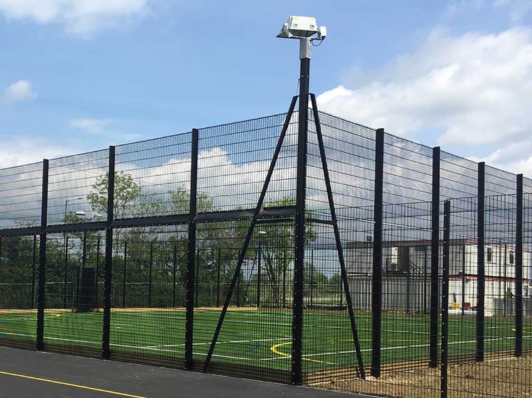 School sports field | high fence and posts
