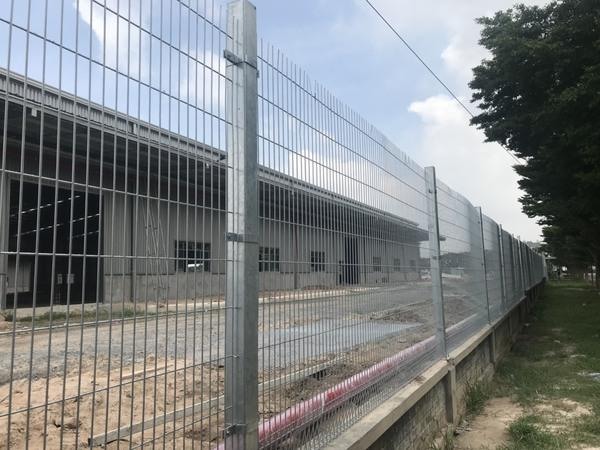 Galvanized welded mesh perimeter fencing installed around an industrial site